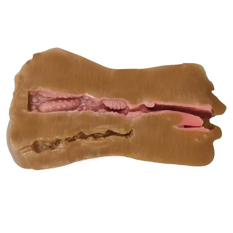 Dvostrani masturbator - IntoYou Jess Dvostrani masturbator - IntoYou Jess - prikaz kanala za penetraciju - veći kanal koji spaja usta na jednoj strani i vaginalni otvor na drugoj strani. Vidljiv je i manji i uži analni kanal